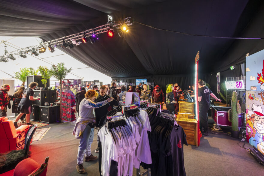 Lighting and blackout lining inside a temporary festival marquee used for selling merchendise at download festival